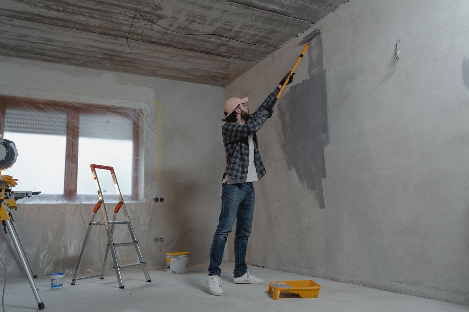 Unfinished room being painted during a renovation — illustrative of construction cleaning across Sydney